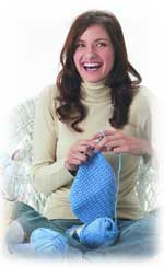 woman in jeans knitting
